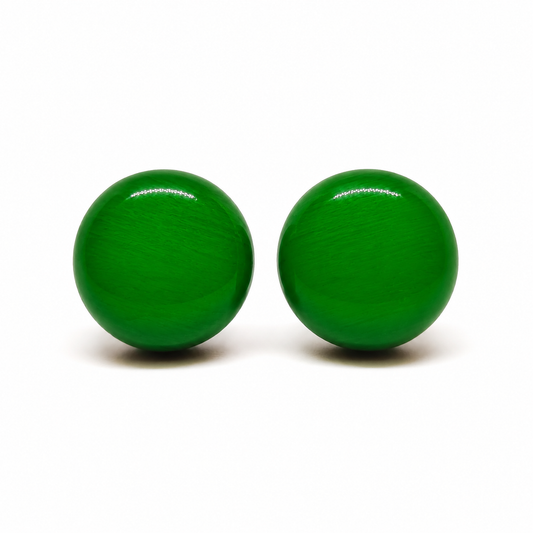Pair of green round earrings on a white background cruella deville jewelry rbg earrings christmas earrings st patricks day earrings
