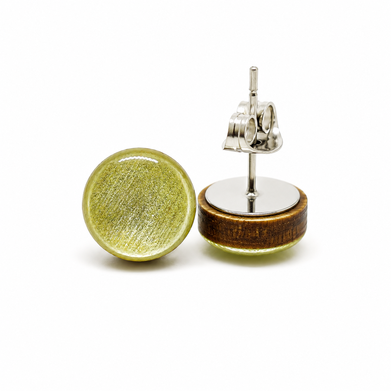 Round earrings with green and wooden design on a white background