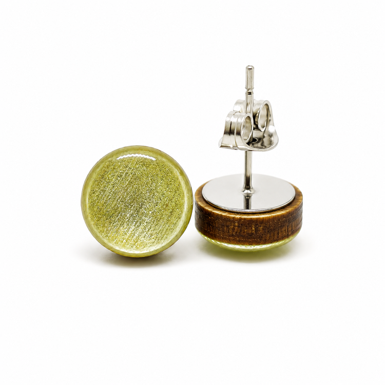 Round earrings with green and wooden design on a white background