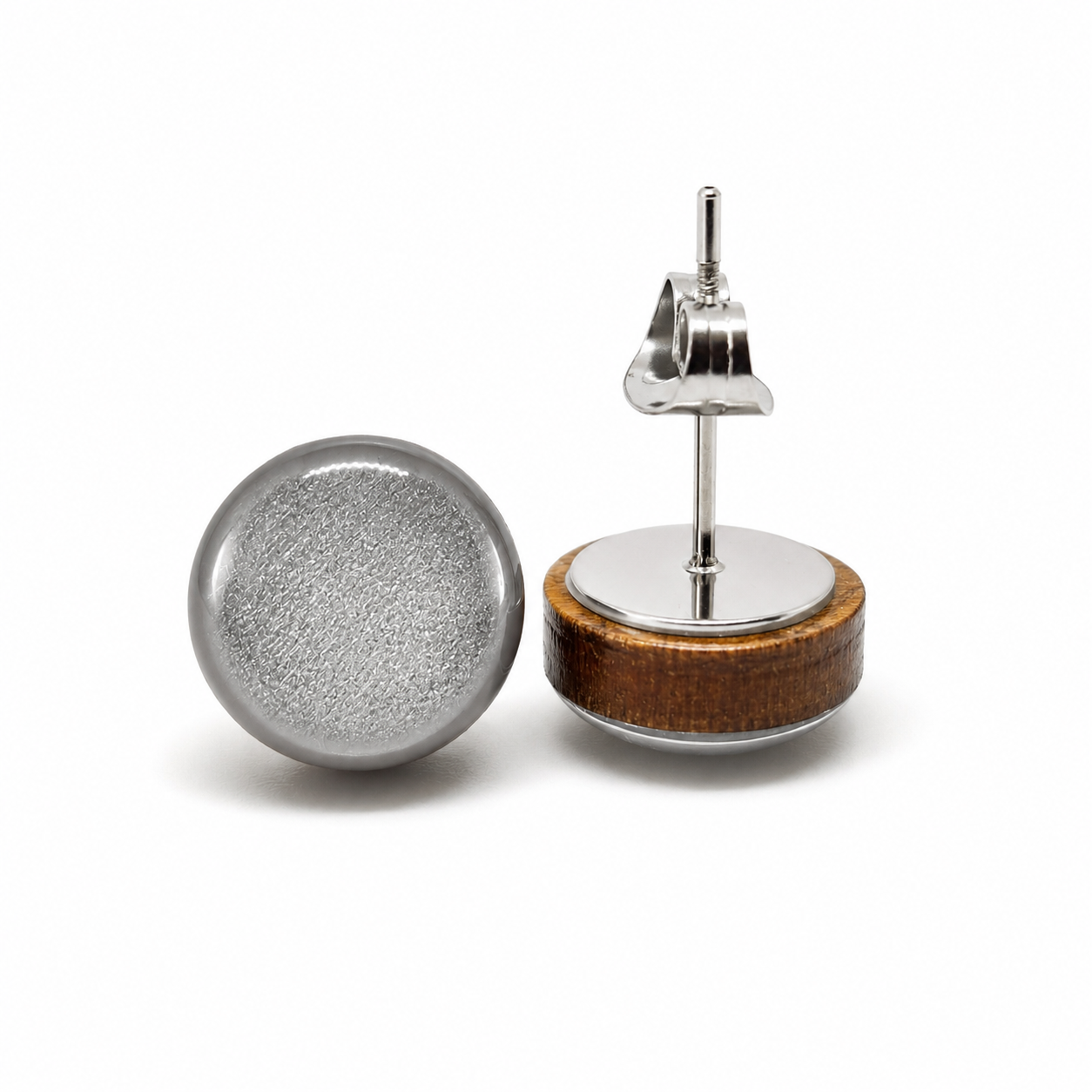 Earring with wooden base and metallic components on a white background