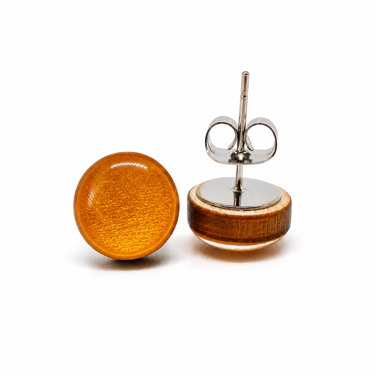 Wooden round earrings with silver posts on a white background