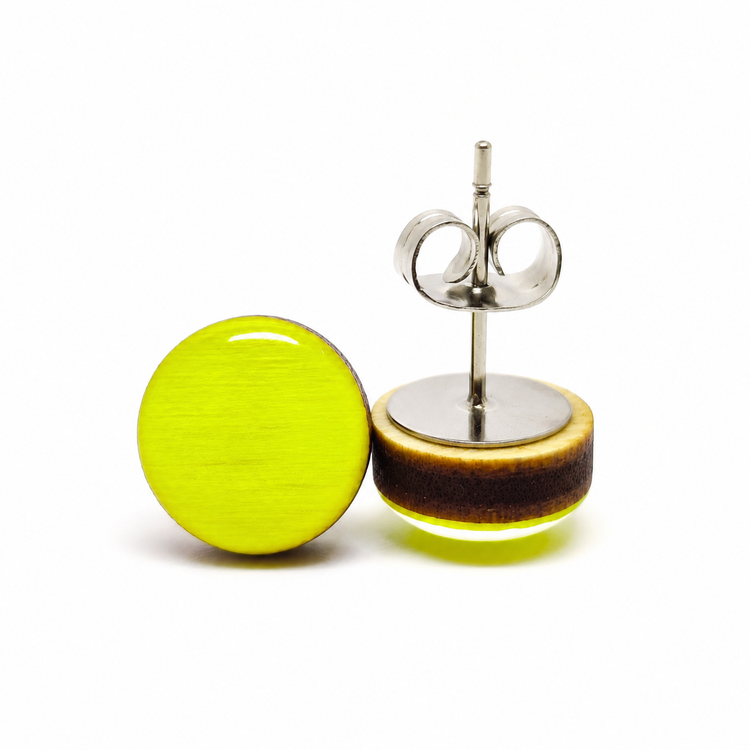Pair of round earrings with a yellow and brown design on a white background
