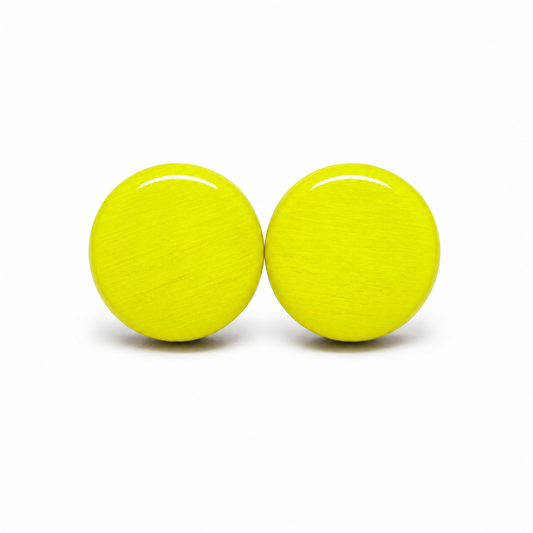 Pair of bright yellow round earrings on a white background