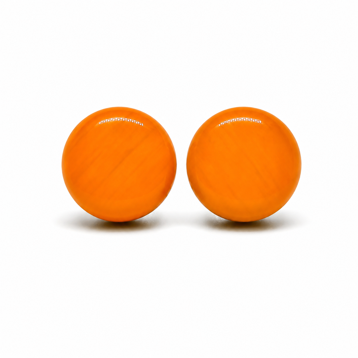 Two orange balls with a brand logo on a white background