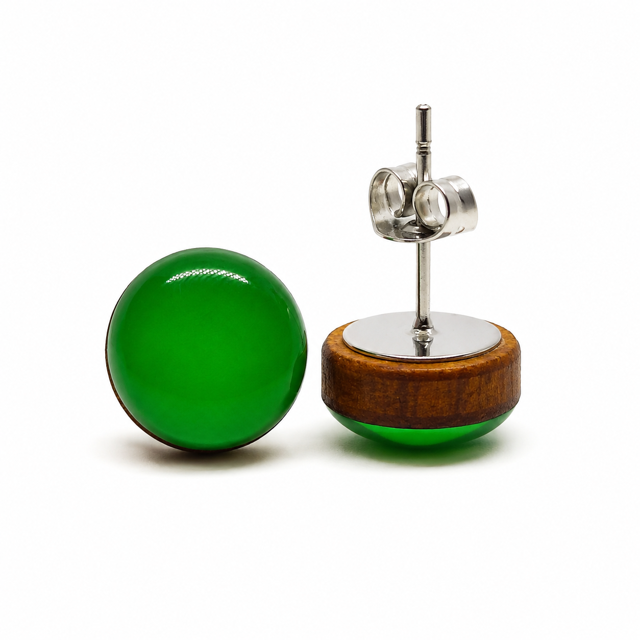 Green round earrings with wooden base on a white background